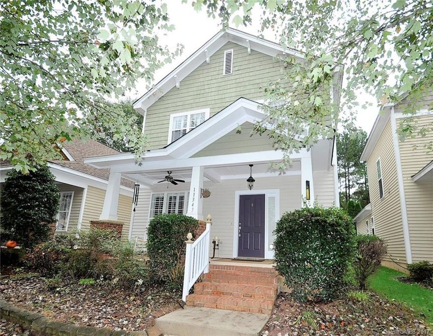 Adorable Charleston Style home in popular Ballantyne location! Sit on your front porch and enjoy the tree lined street. Inside the home has a flowing floorplan with updated kitchen featuring granite, tile backsplash and stainless steel appliances.  Laminate wood floors on the main level. Master has two closets and extra storage area in bathroom. Brick paver patio in fenced backyard leads to your private 2 car garage with pull down attic storage. Plantation shutters add to the charm.  Must see!