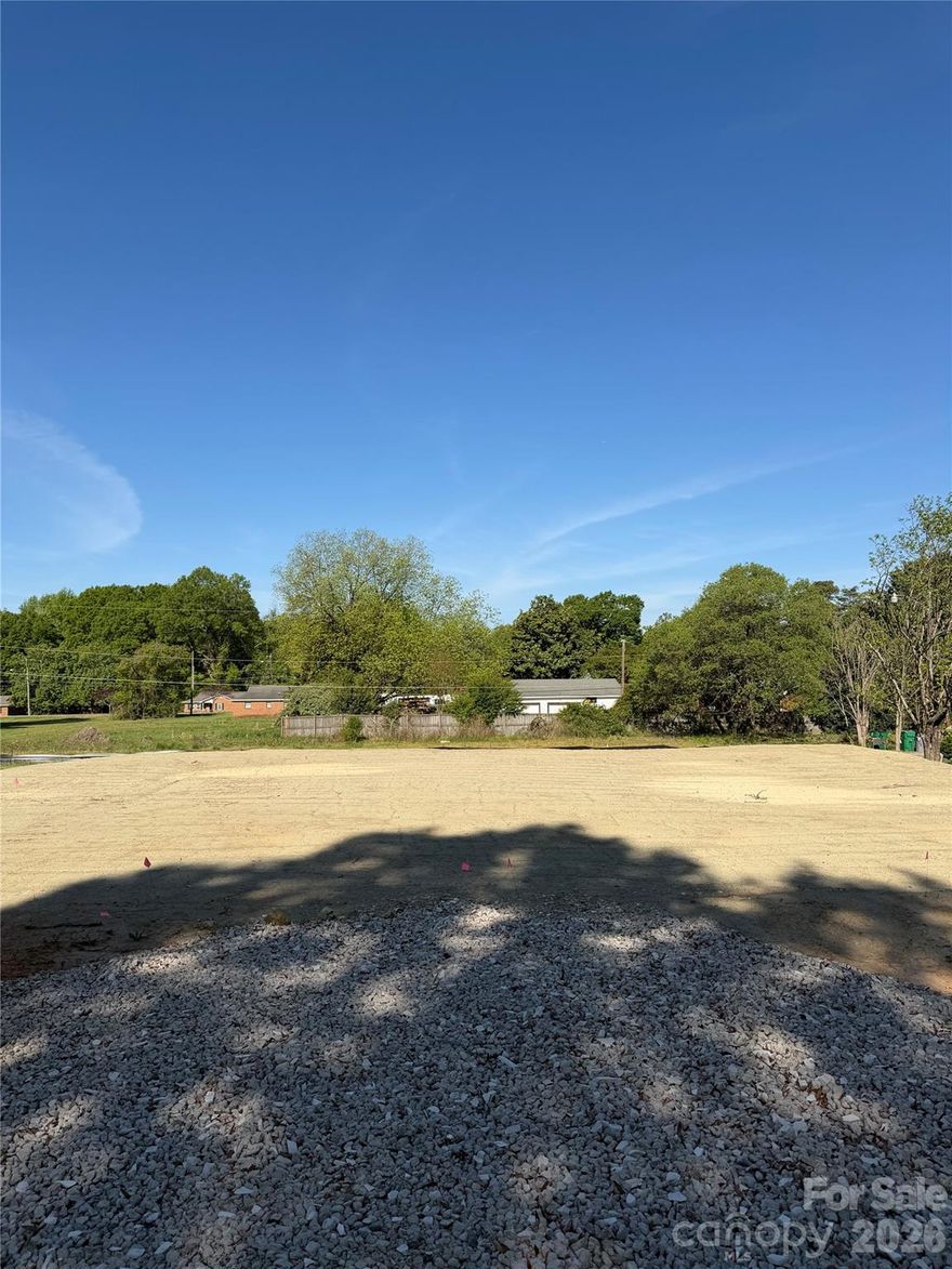 Fully approved, platted and pad-ready 3 unit development opportunity in East Charlotte. Site is prepped for monoslab foundations, allowing for an efficient and immediate path to vertical construction. Includes one set of water and sewer taps (valued at $17,340), significantly reducing upfront costs and timelines. Urban Forestry Tree Mitigation Fees have also already been paid. Ideal for builders, developers, or investors seeking a streamlined project with no entitlement or site work risk. Rare opportunity in a strong growth corridor with multiple exit strategies, including build-to-sell or build-to-rent. The adjoining lot is also available, offering the opportunity to scale to a 6-unit development.