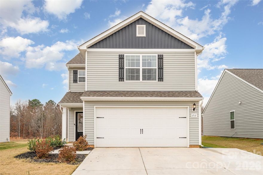 Over $8000 invested in upgrades, featuring a back concrete patio and an expansion three-car driveway. Welcome to this beautifully maintained, nearly new 2-year-old home offering modern comfort, thoughtful upgrades, and a serene natural setting. Featuring 3 spacious bedrooms and 2.5 bathrooms.

Step inside to discover a bright, open-concept layout perfect for both everyday living and entertaining. The kitchen flows seamlessly into the dining and living areas, creating a warm and inviting space.

One of the highlights of this property is its quiet backdrop of mature woods, offering privacy and a peaceful view right from your backyard. The owners have thoughtfully enhanced the outdoor space with a new concrete patio slab, perfect for grilling, relaxing, or hosting gatherings.
Additional upgrades include an expanded driveway designed to comfortably accommodate three vehicles

With its modern features, upgraded outdoor spaces, and tranquil location, this home is move-in ready and truly stands out. Don’t miss your chance to make it yours!