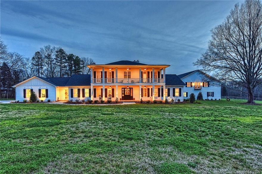 Stunning plantation style custom built home exquisitely designed & overflowing w/special features. 10' ceilings & windows flood the home w/light. Immense kitchen is a cook's dream w/quartz counters, huge island & built in Thermador appl. Master on main has a fireplace & expansive master bath. 2nd level features 3 addtl BRs each w/private bath & a bonus. Enjoy outdoor living at it's best w/in ground pool w/motorized retractable cover, over 2700' of covered porch, fireplace & outdoor kitchen.