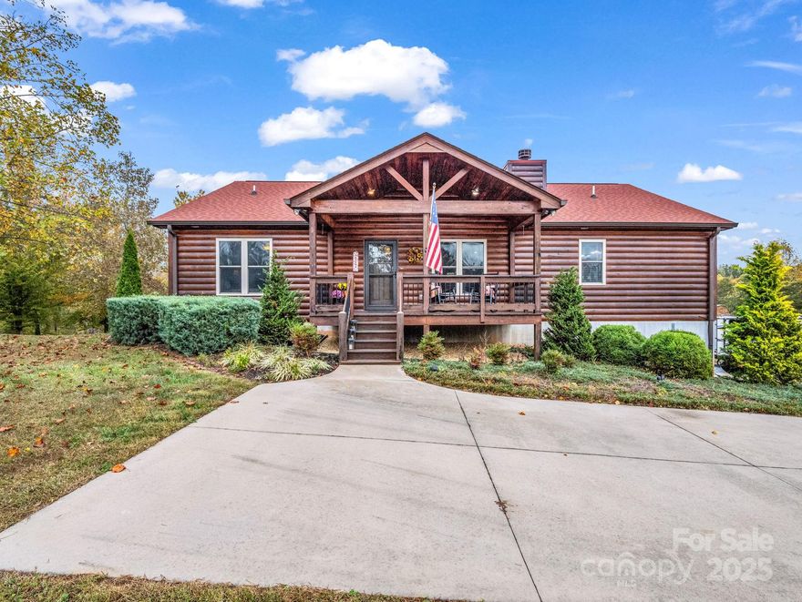 Welcome home! This beautiful log sided home located in the very desirable gated community Hearthstone Ridge has so much to offer. First time on the market, this home is well maintained. Once you enter the front door you will find an open concept, perfect for entertaining. The living room has a 42" woodburning rock fireplace, vaulted ceiling, hardwood floors. The kitchen has granite countertops with tall custom cabinets for extra storage. Sliding doors from the dining area leading out onto the covered porch which extends the entire length of the home. In the primary suite which also has sliding doors leading to the back porch, there is a walk-in closet, ceramic tile bathroom has jacuzzi tub, separate shower, double sink granite vanity. The second bedroom has hardwood floors with plenty of closet space. Bathroom is located in hallway also has granite top vanity and shower. Laundry room is spacious and has a door leading onto the back porch. Downstairs in the basement is the third bedroom currently being used as a multipurpose room. Rough in plumbing ready for a bathroom to be completed. Storage room in basement.
The oversized double car garage is big enough for cars and storage. Don't forget about the outside detached 12 X 24 shed with electricity ran to it. 
This beautiful home sits on 4.6 acres of beauty! Located close to Hwy 221, Interstate 40 and I-26. You are close enough to restaurants, shopping and entertaining but in a secluded setting. 
This home will not last long!