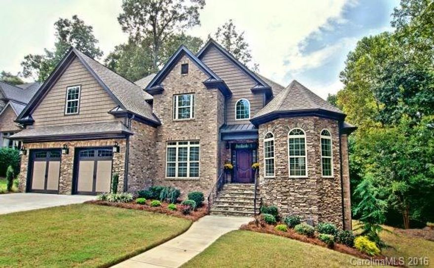 Gorgeous custom built home.  Featuring many luxurious upgrades throughout, this home has it ALL.  4bd/3ba with just over 3000sqft.  An open floor plan gives it a much larger feel.  Gourmet kitchen w/ all of the bells & whistles.  Dramatic 2-story living room with stone fp.  Handscrapped Acacia hardwoods throughout the main level.  Large den/playroom.  Master suite is on main floor w/ ample space.  Media room upstairs.  Screened porch to be enjoyed year round. Deck off the back. MINT CONDITION.