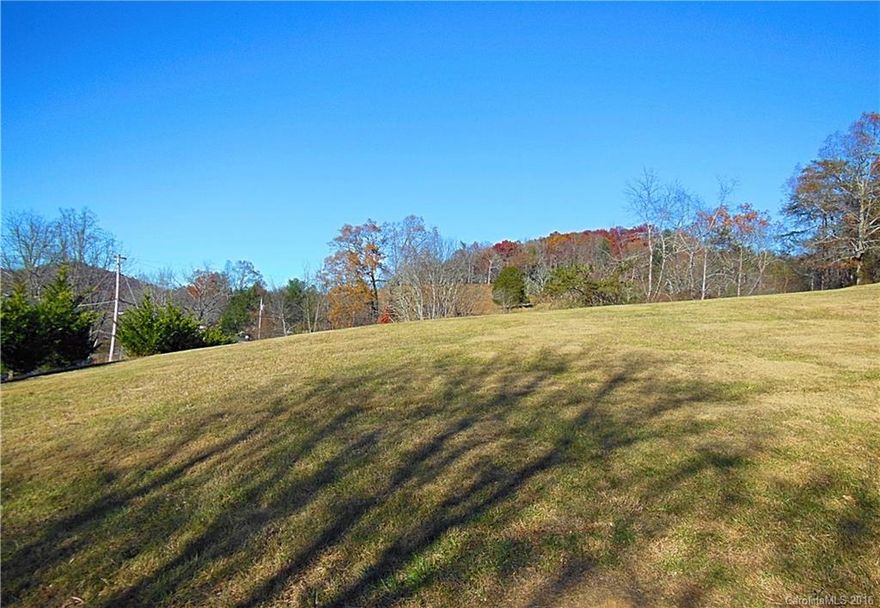 Conveniently located just 15 minutes to downtown Asheville, Farmstead is a well maintained subdivision for modular/doublewide manufacture homes.  This clear and easy to build 0.63 acre lot, offers underground electric, paved road and a beautiful setting with mountain views.  Septic and well required.