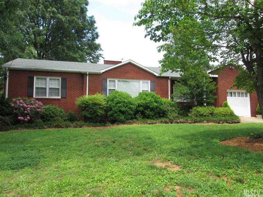 Beautiful 3 bedroom 2 bath brick home in Kentwood Park.  This home features large rooms and hardwood floors.  Spacious living room with crown molding and a fireplace.  Dining room has chair railing and leads the way to the kitchen.  Lots of cabinets, nice counter tops and a tile floor enhance the kitchen area. A breakfast nook overlooking the backyard is a great place to begin the day.  The huge deck is partially covered. Backyard with storage shed and privacy fence. Convenient location near downtown Lenoir.