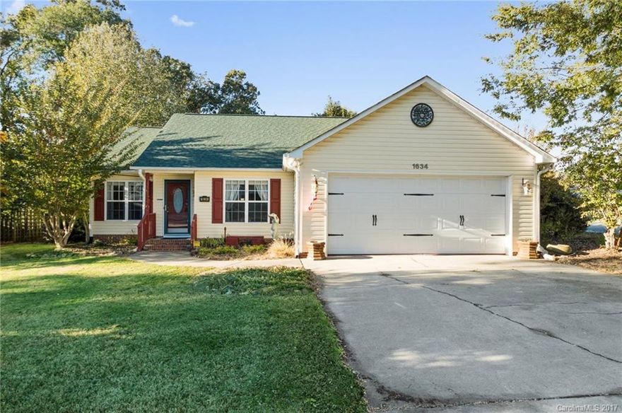 3BR/2BA situated on corner lot. Vaulted great room, fully applianced kitchen with  stainless, trayed master, Do not miss the custom tile in master bath & custom shelving throughout.tile floors, built-ins  and so many custom details! Wired workshop in back yard, and play house. Beautiful flowers in fall, spring and summer PRIVATE back yard. w/ deck and built in gas grill.  2 car garage with workshop and shelving.