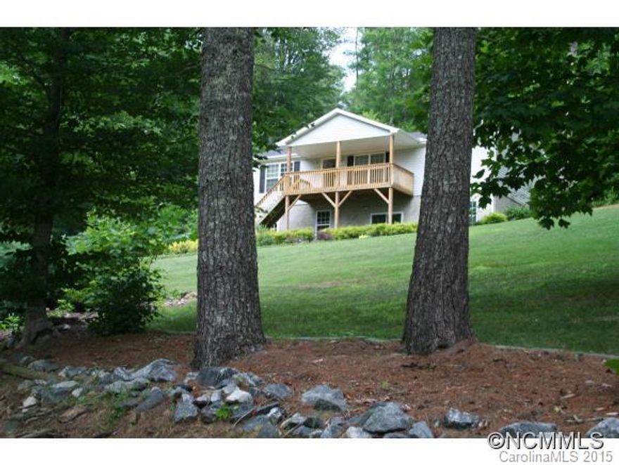 less than 5 miles from downtown Mars Hill with Marshall address; want PRIVACY, seclusion with gorgeous landscaping?This home has it!  Covered front porch and back deck off kitchen to enjoy out doors morning and night.  Several bonus areas in the basement for family room, hobby room, storage.  Must see to appreciate! Large eat-in kitchen, laundry on main, lots of parking space.  Drive up to main level to unload groceries!