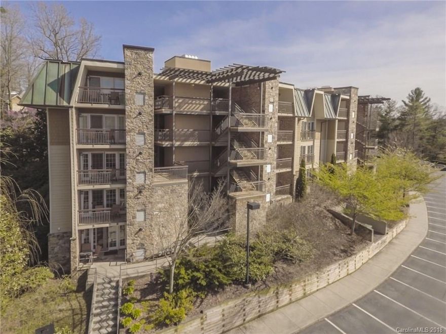 Centrally located in the heart of Asheville NC less than 1/2 mile from Biltmore Mansion and Mission Hospital, Residences at Biltmore is a world class condominium destination offering 24/7 concierge service, resort pool & hot tub, fitness center, elevator, and an outdoor fire pit! This spacious open concept unit showcases gleaming granite counter tops, hardwood floors, stacked stone fireplace, stainless steel appliances, private balcony, and jetted Jacuzzi tub with separate tiled shower. From the flat screen TV's to the luxury linens; this property comes fully furnished for your immediate enjoyment. Walk to numerous fantastic restaurants, shops, galleries, and timeless architecture from this prime location in Biltmore Village, and utilize the professionally managed short-term rental program to generate income while you're away.