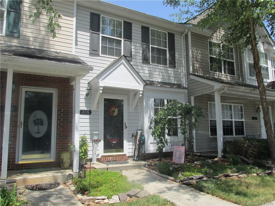 Location, Location, Location!  Fort Mill Schools!  This is a perfect first time home or retirement home that is affordably priced. Nicely manicured garden in front.  Fenced in yard that backs up to trees with no grass to maintain inside the fenced yard. Close to shopping and Hwy 77.  Nice quiet community with a pool with two parking spots right out front.  Common areas and pool are very well maintained!  Wood flooring on the main floor was installed about a year ago.