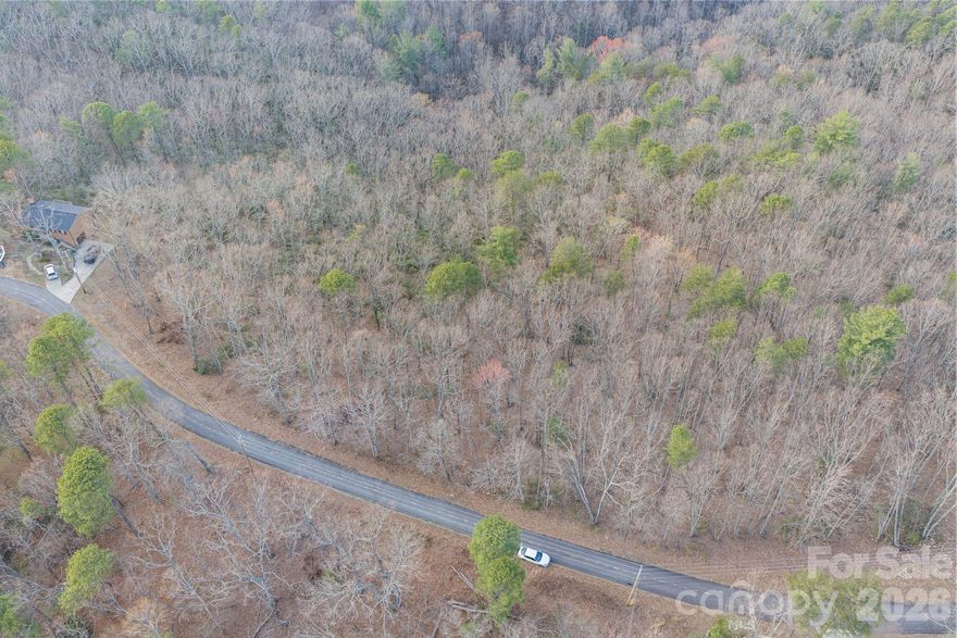 Escape to the mountains with this .46-acre wooded lot located at 6163 Pine Ridge Dr in the gated Pine Mountain Lakes POA community of Connelly Springs, NC. This private property offers a true retreat surrounded by trees, peaceful duck ponds, and scenic walking trails—perfect for building your dream cabin, vacation getaway, or future investment. With the charm of a mountain escape and the security of a gated community, this lot is an ideal opportunity for anyone seeking nature, privacy, and relaxation.