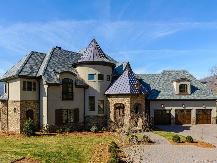 A fabulous new home in the Cliffs at Walnut Cove. Built on one of the premier golf course lots with an incredible view of the lake and mountains.  This Old World European home has an entry with a spiral staircase to the second floor, open kitchen, dining and living area with a built in bar and back lit temperature controlled wine cabinet. High ceilings and a living area which is open to the second floor. Watch the sun set over the mountains from the martini deck.