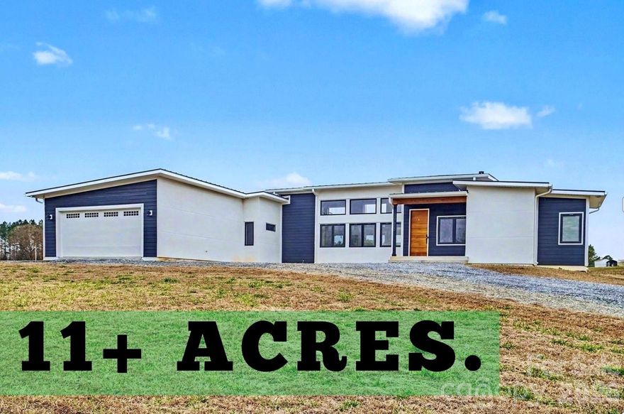 Set on a beautiful crowned lot spanning over 11 gorgeous acres, this striking contemporary home is a rare opportunity to enjoy modern style with the freedom of country living. Step inside and you’ll immediately notice the abundance of natural light throughout, showcasing the home’s character, charm, and rich hardwood floors.

The spacious layout features a relaxing primary suite with a large en suite bath, plus two additional bedrooms with a full bath, offering flexibility for guests or a home office. You’ll also love the generous laundry and pantry area, designed for everyday convenience with plenty of storage.

This home is not only beautiful... it’s efficient and well cared for, featuring a tankless water heater and an encapsulated crawlspace for added comfort, energy savings, and peace of mind.

With wide-open space, scenic views, and a setting that feels truly special, this property offers the perfect blend of privacy, and modern charm....a standout home you’ll be proud to call your own.