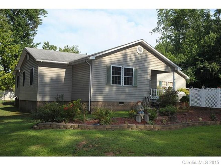 If your looking for a very nice home at the Lake, then this is the one. Living room with a fireplace, wood floors, roomy kitchen, three bedrooms, two baths. Nice patio in back!  A must see home!