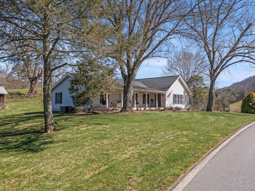 ESCAPE to the country to an area of outstanding beauty.  This RECENTLY UPDATED home is perfectly located just off I-26, 25-45 minutes from all the “Jewels” of the Blue Ridge mountains.  Boone (hiking, skiing), Grandfather Mountain, Asheville, Johnson City, Wolf Laurel (skiing), Banner Elk, Mars Hill (Tour Biking Trails), and The Appalachian Trail will be right at your doorstep. This offering has everything you need to embrace a lifestyle of relaxation and farm living, without having to maintain a farm.  There is ample space to have your own vegetable garden and make "farm to table" a reality for your family.  A vintage outbuilding could be perfect as a gardening shed, work shop, yoga/art studio, etc.,  if given a little love and update.  A 3-car detached garage will provide extra space for your toys, storage and/or office space if you work from home.  High Speed internet is available! 

The peace and tranquility you will enjoy as you relax on your front porch will be priceless.