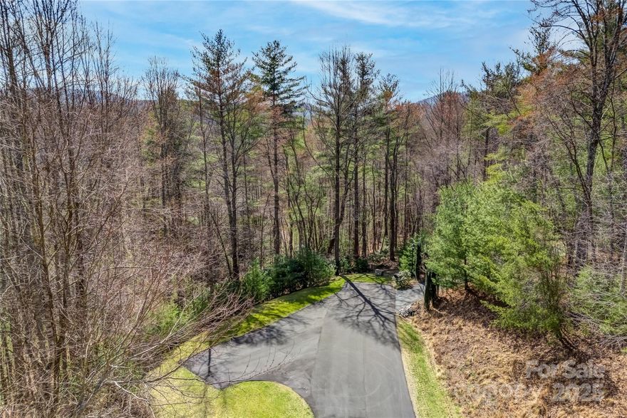 Don’t miss this opportunity to own one of the most buildable, private lots currently available in the prestigious Champion Hills community. Located at 205 Claridge Way, this gently sloped, wooded lot offers the perfect blend of natural beauty and build-ready convenience, ideal for your custom mountain retreat. Nestled near the peaceful back section of the neighborhood, with easy access via the third entrance, this lot offers a serene, secluded setting with plenty of privacy, yet you’re just minutes from the world-class amenities of Champion Hills. A recent topographical survey is available in the listing documents, saving you time and money as you begin the building process. 
•  One of the easiest lots to build on in Champion Hills
•  Topo survey included, build-ready!
•  Located in one of Henderson County’s most desirable golf communities
•  Easy access from the third entrance
•  Seller is motivated and will consider all offers
•  Private, wooded setting with gentle slope