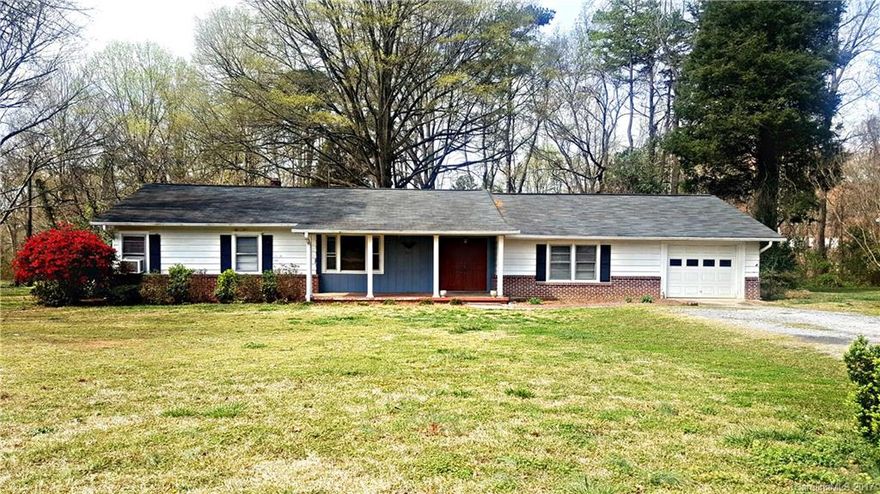 EXCELLENT INVESTMENT OPPORTUNITY!!  Very Convenient Location - easy access to I-85. Tons of storage with large utility room, workshop room, and outside storage building.  Original hardwood floors, farmhouse sink, nice large front porch, 1 acre lot. Being sold as-is. Needs work but seller will not make repairs.