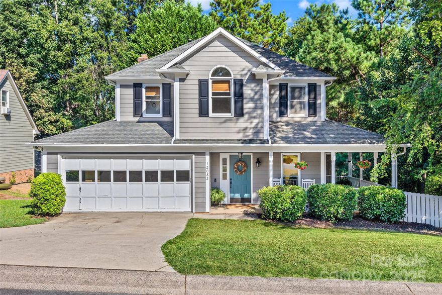 Charming 3BR, 2.5BA home in sought-after Tega Cay! Set on a wooded 0.25-acre cul-de-sac lot, this 2-story gem offers 1,808 sqft of smartly designed space. The main level features hardwood floors, spacious living room w/ wood-burning FP, and a well-equipped kitchen w/ granite, pantry, & adjacent dining area. Upstairs, the oversized primary suite boasts a garden tub & walk-in closet, joined by 2 spacious add’l BRs & full bath. Enjoy serene outdoor living w/ a front porch, wraparound side porch, and rear deck overlooking the fully fenced yard. Attached 2-car garage, updated architectural roof, and main-level laundry add convenience. No HOA. Access trails, golf, lake, playgrounds, tennis, & more. Close to Lake Wylie, shopping, & dining—this move-in ready home delivers comfort, location, & value! Please check for school enrollment freezes.