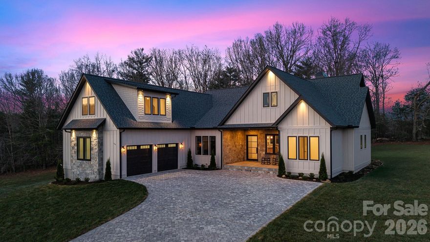 Experience luxury mountain living in this custom-designed home set on a private, nearly 1-acre lot (0.85 acres) with breathtaking mountain views from nearly every window.

This fully finished home was thoughtfully designed with high-end materials and timeless style.

The interior features wide-plank white oak hardwood floors, custom cabinetry throughout, and Restoration Hardware lighting. The living room offers vaulted ceilings with exposed beams and a wood-burning fireplace with a gas start, creating a warm mountain-modern feel.

The chef’s kitchen features Taj Mahal natural stone countertops with a full slab backsplash, premium professional Bosch appliances, and a spacious butler’s pantry with custom cabinetry and plenty of storage.

A beautiful office/library with custom built-ins provides the perfect space for work or reading.

Every bedroom is designed as a private suite with its own full bathroom and walk-in closet. 

Master bedroom features heated marble floors and a stunning custom walk-in closet. All bathrooms are finished with Italian marble tile and marble countertops.

The spacious laundry room features heated floors, generous workspace, and mountain views from the windows.
Outdoor living includes a front porch with beautiful mountain views, a private backyard, a screened porch, and a dedicated grilling area for entertaining.

Additional features include:

• Whole-home generator
• Commercial-grade Ubiquiti internet system
• Custom iron front door
• Central vacuum system
• Paver driveway

A rare opportunity to own a completely finished custom mountain home with luxury finishes, privacy, and spectacular views.