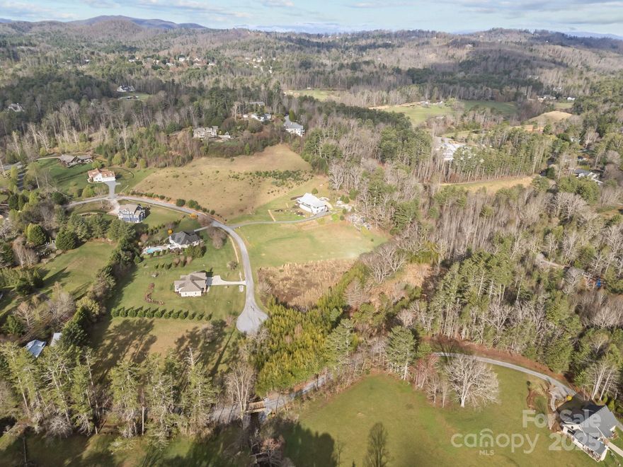 Discover an exceptional 2.13-acre estate lot in A’Virea, an exclusive gated community of fine homes. Perfectly situated on a private cul-de-sac, this level and cleared homesite is bordered by a bold stream with small waterfalls, offering a serene and picturesque setting. The property features underground utilities and an expired 3-bedroom septic permit on file, making it an easy build. Just minutes from downtown Main Street, this is a rare opportunity to secure a prime homesite in a highly sought-after location!