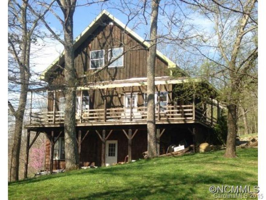 Contemporary mountain home, 3BR/3BA in main house with a full apartment over the garage/workshop (now artists studio). Long range views from both units. Main house has covered wrap porch and deck off Kitchen. Two Master suites with another BR downstairs. Worshop and shed. Garden site. Part of Wise Acres Community. Ownership of private home and acreage and shared ownership of additional 55 ac.