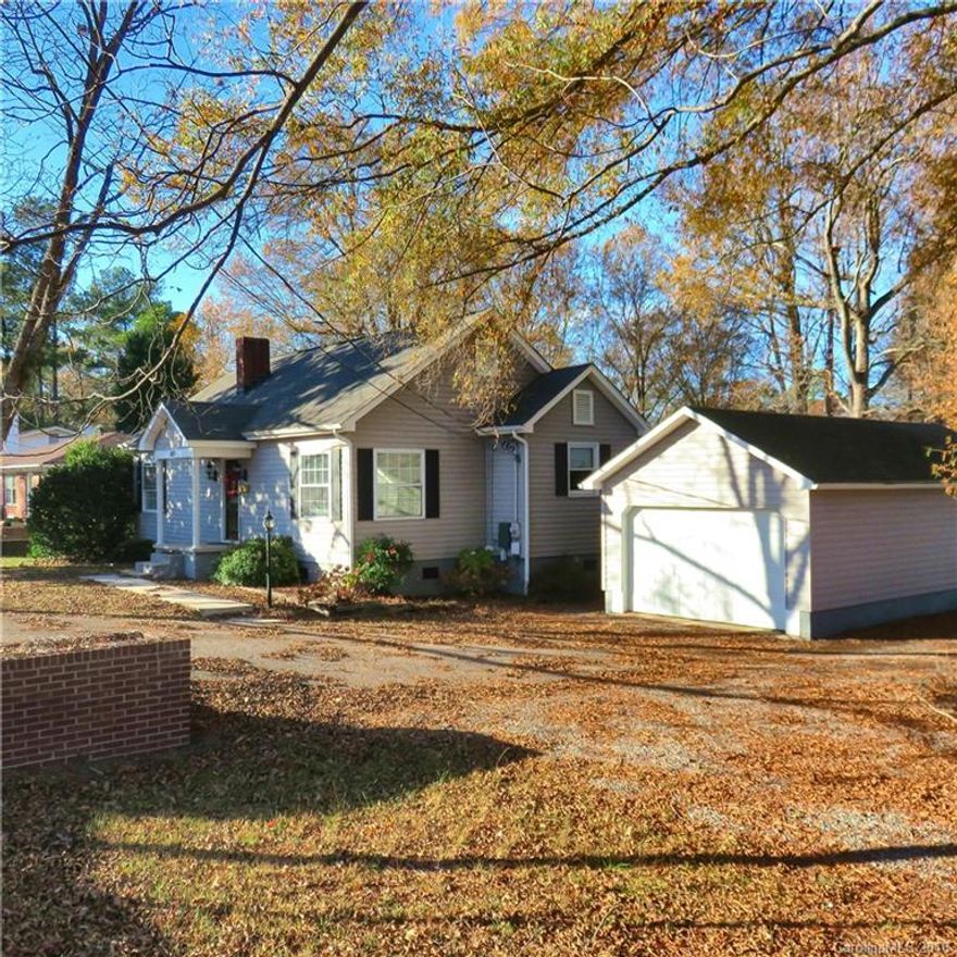 Clover Charmer: Renovated & updated Ranch home on .61 acre level lot! Hardwood floors, newer roof, updated bathrooms, freshly painted, newer carpet, new garage opener & refrigerator conveys! Detached garage has storage or work-shop area. Walking distance to restaurants, fresh seafood, drug stores/grocery, football games, the library & downtown Clover!