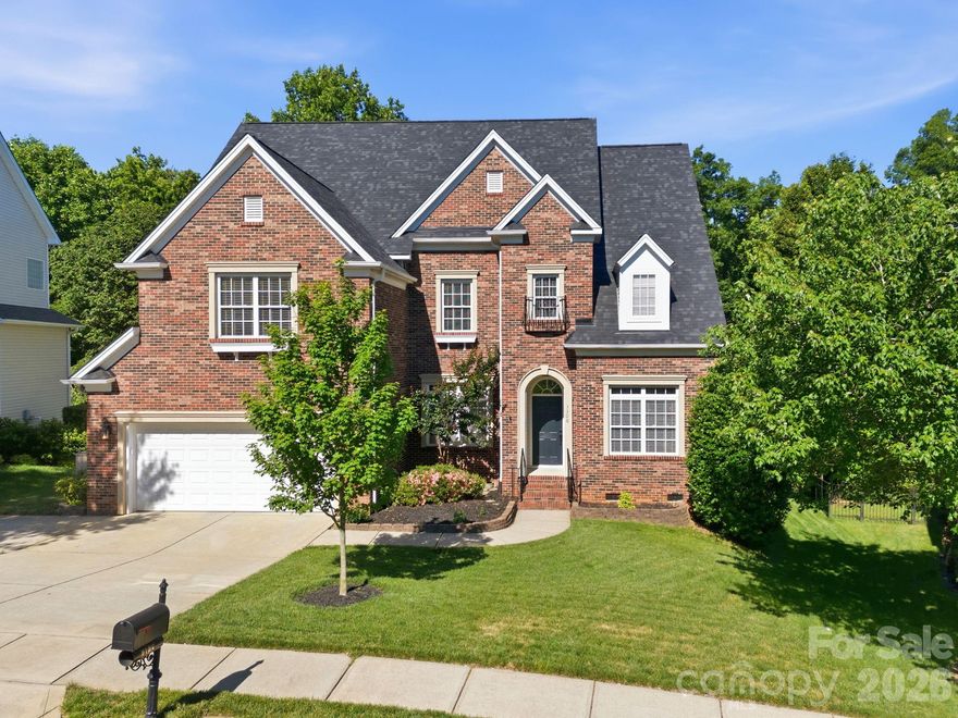 Welcome to this beautifully designed home. Offering an unparalleled blend of space and style, this home is perfect for both entertaining and everyday living. Step inside to discover beautiful woodwork, lovely wood floors and rooms bathed in natural light. This home features both a formal living room and formal dining room, perfect for entertaining family and friends. The kitchen provides a wonderful space for the chef of the home. The kitchen features stainless appliances, an oversized island, solid surface counters, gas range, pantry, breakfast area and ample storage. The great room opens to the kitchen and is spacious with a gas log fireplace. The primary bedroom suite is an owner’s retreat. The primary bathroom features a step-in shower, garden tub, dual vanity sinks, powder bath and huge walk-in closet. There are three additional bedrooms as well as the 5th Bedroom/Bonus on the second floor. The 5th Bedroom/Bonus doesn’t have a closet, but there is room to add one. For added versatility, the third floor bonus is ideal for a playroom, movie room, craft space and more. This room has a built-in counter, which could be a great popcorn or snack area. Don’t miss seeing the huge walk-in storage space off of this room (and I mean huge)! Second level laundry room has cabinetry, laundry sink and window. Just off the kitchen and great room, step outside to a beautiful oasis featuring multiple decking areas ideal for alfresco dining or simply enjoying the Southern seasons. This expansive deck has both covered and uncovered areas with room for multiple seating areas. The beautiful landscaped grounds showcase a tiered rear yard, offering both scenic beauty and functional space for outdoor activities. 
If you have been searching for a garage with over 700 square feet, here it is! It may look like a 2-car garage from the outside, but this tandem 3-car garage has space for vehicles and hobbies alike. The garage has a laundry sink, ample cabinetry and a utility room with additional shelving. Priced below a recent appraisal, this home offers an exceptional value in today’s market. Highland Creek has many amenities, including numerous outdoor pools, tennis courts, pickleball courts, playgrounds, a fitness center and more. While this location offers convenience to major highways, shopping and restaurants, it still maintains the tranquility of suburban life. Don’t miss the opportunity to make this your forever home here in Charlotte.