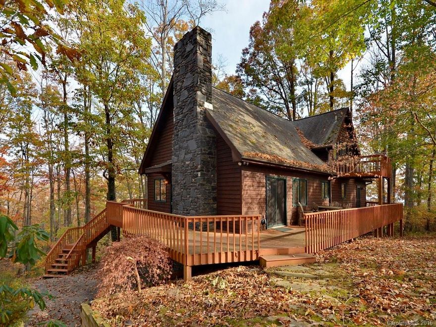 Well maintained A-frame on top of Concord Mtn. offers wooded privacy w/360-degree winter views & wrap-around deck to take it all in! Mtn. get-away feel, but S.Asheville conveniences only 15 min away.MBR suite w/its own private deck, gas log FP, garden tub & 2 walk-in closets. GR has wood-burning stone FP & vaulted ceilings; ridge-top sunset views. Open floor plan; primary residence, second home or vacation rental.  New retaining wall, well pump, water-filtration system & new roof (January 2017)!