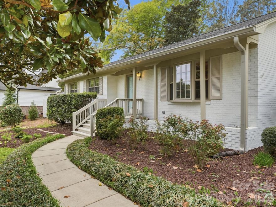 Charming, beautifully updated & painted single story brick home on a 0.55 acre lot only two blocks from Main Street in Davidson. Also a quick walk to Davidson Elementary School. 4 bedrooms, 2.5 baths and an office. Fenced backyard is absolutely beautiful with mature trees and landscaping. Original hardwood floors and an updated kitchen with white cabinetry to the ceiling, granite countertops, a large island with additional bar seating, white subway tile backsplash, gas range and stainless steel appliances. Large great room with French doors to deck, a gas  fireplace with a beautiful brick hearth, spacious office with built-in shelves & another gas fireplace plus a living room/dining room combination. Deck and pergola, walking paths, fountain, seating areas and garden beds. Walk to shops, restaurants and Old Town Cornelius. Don’t miss out on this beautifully renovated single story brick home with such easy access to Davidson!
