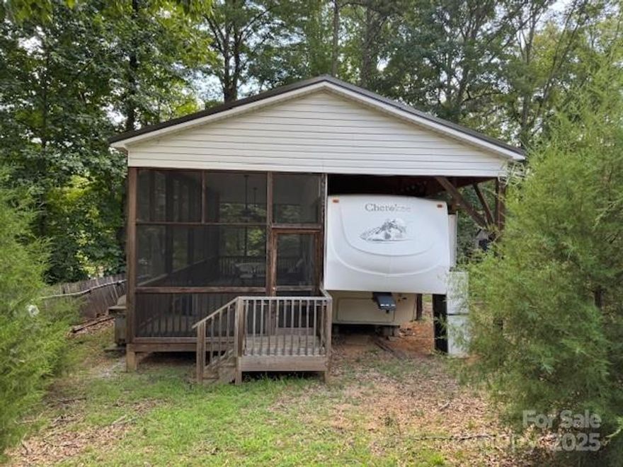 New Listing Cherokee 5th wheel travel trailer with large screen porch selling due to health issues.  Very roomy property in quiet area of Twin Harbor.  Furnished, appliances remain, deck table & chairs included.