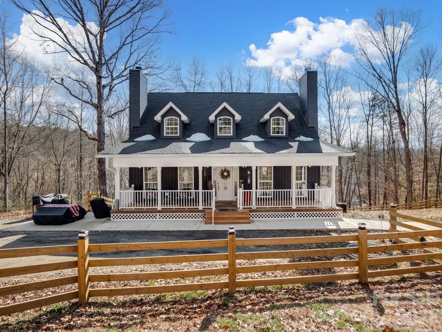 This one-of-a-kind, private, lakefront home situated on a stunning 4.66-acre lot offers the perfect blend of seclusion and natural beauty. Soaring cathedral ceilings flood the home with light and create an inviting atmosphere. The cozy living room features a wood-burning fireplace ideal for gatherings, while the primary bedroom offers its own charming wood-burning fireplace for ultimate relaxation. Upstairs, find two additional spacious bedrooms, a large full bathroom, and a flexible bonus/office room. Key highlights include two wood-burning fireplaces total, a walk-in pantry, and a partially finished walk-out basement with double French doors opening to a serene patio in the fenced backyard — perfect for outdoor entertaining, morning coffee, or simply enjoying the tranquil surroundings. Step outside to breathtaking natural surroundings: a picturesque gravel driveway lined with flourishing fruit trees (peach, pear, plum, and apple), a meandering natural spring, and direct lake frontage with a dockable shoreline on Lake Lookout. Water enthusiasts will love the easy access to a nearby public boat launch for fishing, kayaking, boating, and more. Additional practical features: a computerized well with filtration system, outdoor gas hot water heater with circulation for instant hot water, and a detached heated/cooled two-car garage PLUS an ON-GRID 61" x 91" 800 WATT SOLAR PANEL. The property is accessed via two driveways (one concrete, one gravel) for added convenience and privacy. As a unique bonus, it includes a custom-built, whimsically decorated Gypsy Cart for your own special escape! This exceptional home is more than just a residence — it's a peaceful lifestyle retreat where every day feels like a vacation. Close to parks, shopping, and outdoor recreation in the desirable Statesville area. An exceptional opportunity to own water lake property for under $1,000,000! Transferable home warranty! The wood Planer, Table Saw, Generator, Air Compressor, 3D printer, window AC units are not for sale and do not convey.