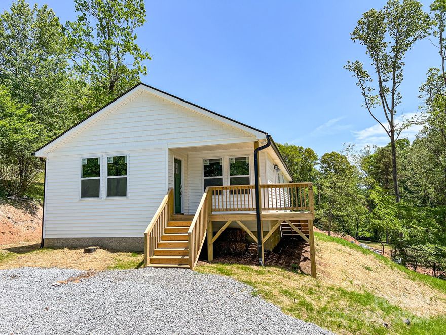 Listen to the sounds of the creek on your deck! Brand new construction centrally located and convenient to everything Arden and South Asheville have to offer. Only 7 minutes to Biltmore Park! Open floor plan bathed with warm natural light is perfect for entertaining. Roomy primary bedroom boasts a large walk-in closet and elegant primary bath with dual vanity and refreshing custom tile shower. Luxury vinyl plank flooring, fabulous kitchen with stainless steel appliances, granite counters, spacious all-plywood soft close cabinets, under cabinet lighting, and the perfect kitchen island. Neutral colors make decorating a breeze. Large decks are a spectacular place to enjoy that clean mountain air. Well-priced, move-in ready and waiting to hold all of your fond memories or become your next charming retreat or investment property. Finishes are consistent, but may vary slightly depending on availability. Tax value based on previous vacant land and does not represent current improvements.