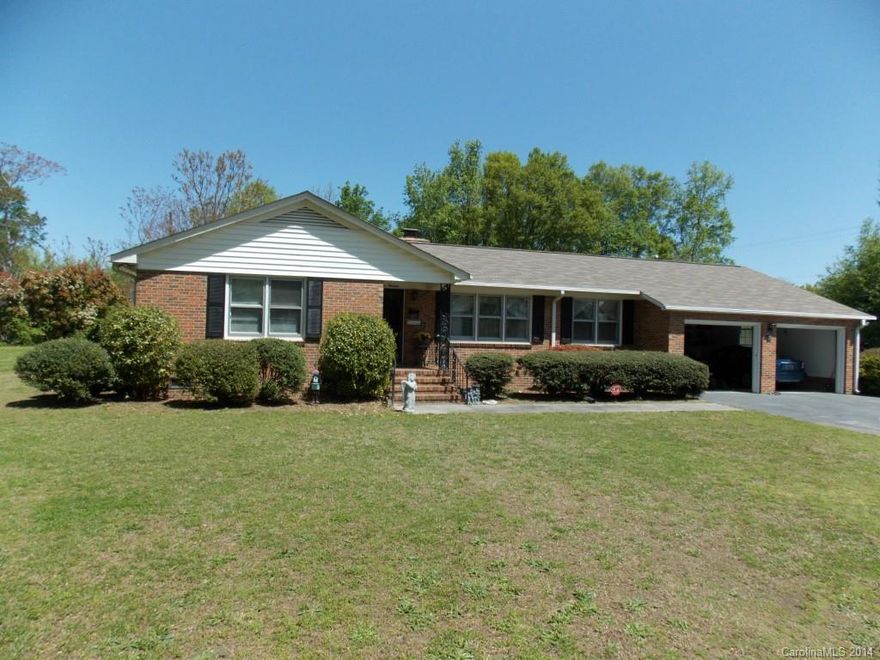 Tranquil brick ranch home featuring three bedrooms, two full bathrooms, kitchen with dinette seating area, fireplace off of the kitchen, formal dining room, great room, fenced backyard with back patio, attached two car garage and unheated storage area behind the garage.  All within walking distance of down town Clover.