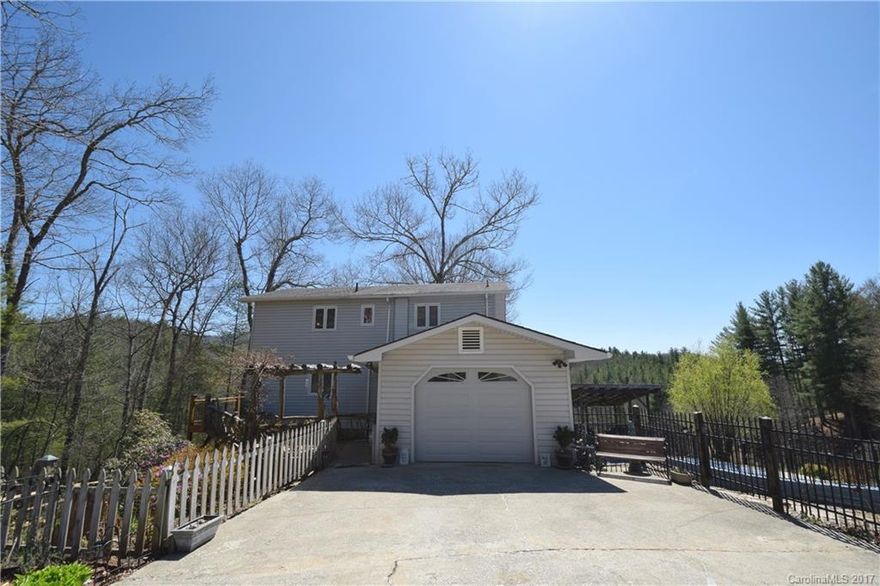 Private Organic Mini Farm! Gently rolling 5 acres with stream boundary, a large pond, huge barn workshop with built in dust collection system, large chicken coop, additional large workshop, storage building and a salt water in ground pool! Garden space near stream. Large multi-generational home! Main level living boasts huge stone fireplace with wood stove insert & chefs kitchen & 1 bdrm. 2 bdrms + bath upstairs. Large basement w bath + additional family room. The ultimate great mountain escape!