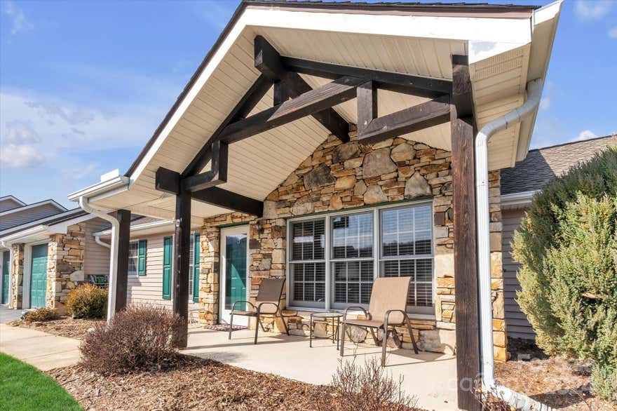 A rare opportunity to purchase a home in the highly sought after Hills at Averys Creek  55+ gated community. This meticulously maintained home offers the perfect blend of comfort, convenience, and community living. This is a coveted end unit featuring 2 bedrooms, 2 bathrooms, a bonus room, and an enclosed porch. All this with no steps and a 1 car attached garage. The bonus room is amazing as an office, sitting room, or so many uses. Step out to the enclosed porch, ideal for savoring your morning coffee or soaking in the evening sunset. The spacious living area is perfect for entertaining guests or enjoying quiet evenings at home. The HOA dues include exterior maintenance, water, trash, sewer, and lawn care. Just minutes from the Blue Ridge Parkway entrance, NC Arboretum, Asheville airport, Biltmore Park, and so much more. Whether you're looking to downsize or seeking an active adult lifestyle, don't miss your chance to experience the comfort and community this townhouse has to offer.
