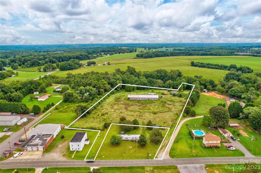 Amazing opportunity to own 5.6 acres off of Old Mountain Road with 2 points of access off main road. Hand-built horse barn on property. The property was previously used for horse training and riding lessons. Septic installed on the property and county water is available. Old manufactured home on the property that could be renovated or removed based on buyer's preference.
