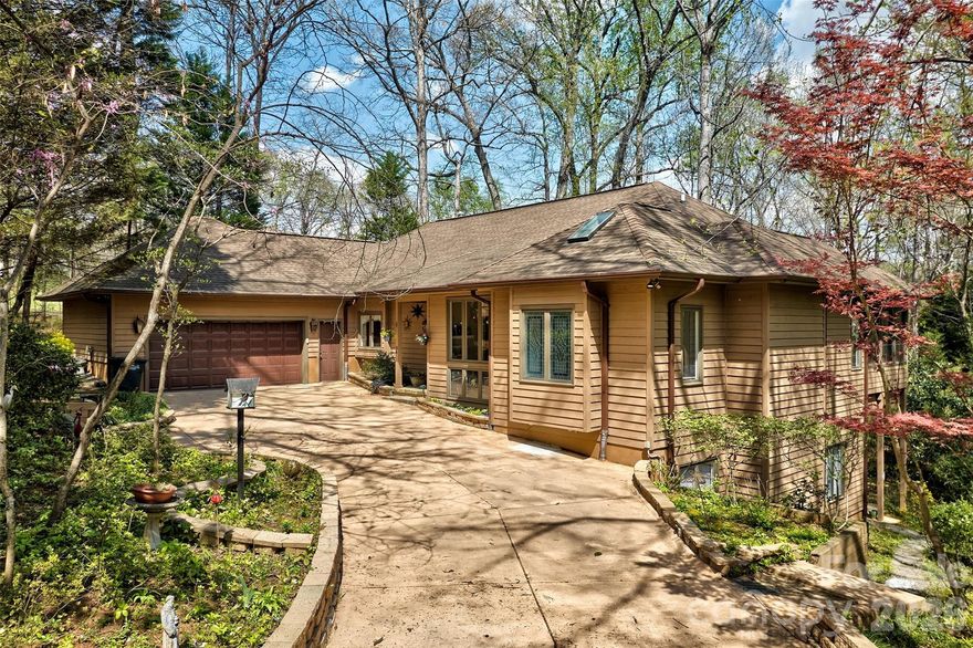 WELCOME HOME TO YOUR MOUNTAIN HOME FEEL BUT ALMOST ON THE LAKE!  THIS 1 IS NESTLED IN THE TREES FOR A TREE HOUSE FEEL FROM YOUR OVER 700 SQUARE FOOT SUNROOM WITH CATHEDRAL CEILINGS AND SO MANY WINDOWS! TALK ABOUT BRINGING THE OUTSIDE IN!  MAIN LEVEL LIVING INCLUDES PRIMARY BEDROOM AND BATH , OPEN KITCHEN WITH BUILT IN REFRIGERATOR, COZY DEN WITH 3 SIDED FIREPLACE, DINING ROOM, GREAT ROOM WITH 2 STORY CEILINGS ALSO , 1/2 BATH AND SUCH AN OPEN FLOOR PLAN.  DOWNSTAIRS HAS 2 BEDROOMS AND BATH.  SUNROOM ADDITION COMPLETED IN 2021. WHOLE HOUSE GENERATOR . GARAGE HAS CLEAN EPOXY FLOORING. WALK IN LAUNDRY ROOM ON MAIN FOOR FOR EASE AND ROOM.  NO YARD WORK! THIS HOME SITS ON QUIET CUL DE SAC SO NO DRIVE BY TRAFFIC.  RIVER HILLS IS A GATED COMMUNITY WITH 24/7 SECURITY, HAS COUNTRY CLUB W 18 HOLE COURSE AND 2 POOLS, TENNIS AND RACKETBALL OFFERED AT ADDITIONAL COSTS.  WE ALSO HAVE A MARINA FOR RESIDENTS.  NEIGHBORHOOD OFFERS MILES OF WALKING TRAILS, PLAYGROUNDS, DOG PARK, WATERFRONT PARK WITH SANDY BEACH AND PICNIC PAVILION, GARDENS AND MORE.  THIS HOME IS ZONED FOR THE NEW LAKE WYLIE HIGH SCHOOL FOR FALL 2026.  ENJOY LIFE AT THE LAKE!