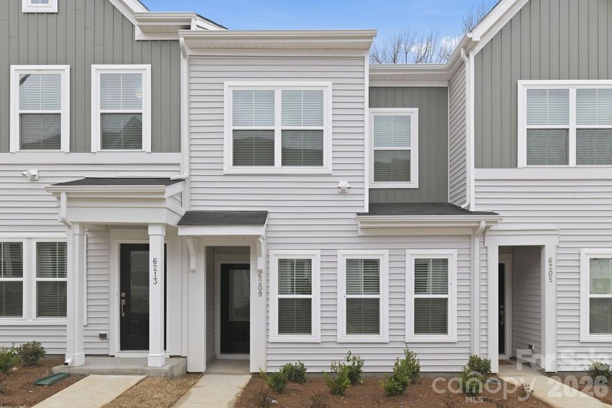Discover the charm of this boutique townhome community built by Mungo Homes, a leader in quality craftsmanship & luxury design. This beautiful West-facing two-story townhome with court-yard entry features 3 bedrooms, 2.5 baths, & a rear-entry one-car garage, offering an open-concept layout w/ stylish upgrades finishes throughout. The main floor boasts luxury vinyl plank flooring, creating a seamless flow through the bright & airy living spaces. The chef’s kitchen is a standout, featuring a large sitting island w/ quartz countertop, stone-gray cabinetry, tile backsplash, pendant lighting, & SS electric appliances! Upstairs, the spacious primary suite impresses w/ a 10' boxed tray ceiling, generous walk-in closet, & a en-suite bath w/ a quartz-topped dual vanity & a tiled walk-in shower. Two additional bedrooms, a full bath, & a convenient laundry closet complete the second level. Located 10 minutes from Uptown Charlotte, the airport, & side-walk access to shopping at Target and Northlake Mall, Lakeview Village offers the perfect blend of style, comfort, & convenience. Ask about the included Move-in appliance package, Blinds, and Financing Promotions with seller paid closing costs! 2025 Parade of Homes GOLD Winner!
