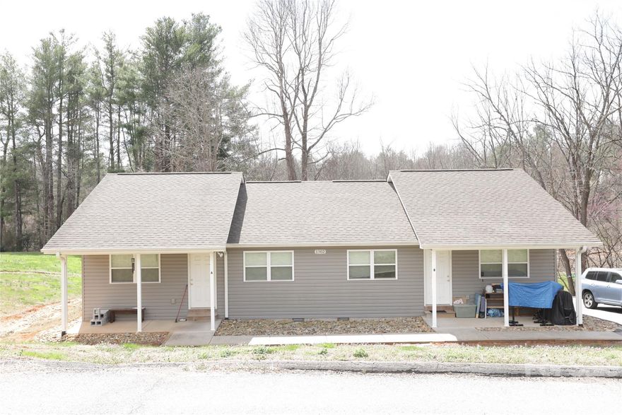 Rare opportunity to own a single-level duplex just minutes from downtown Hendersonville! Each unit features an inviting open-concept layout with 2 bedrooms and 1 full bath, offering comfortable and functional living. Both units enjoy their own welcoming front porch—perfect for relaxing or entertaining. Connected to city water and sewer with no city taxes. A great addition to any investment portfolio.