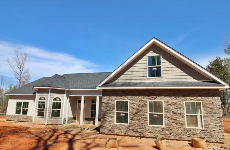 This one is getting started in The Estates at Glenmoor, the Charleston of the upstate in Historic York.  Finished pix are of this plan built on another lot.  Get in early to make your choices!   Hardwood and tile plus granite counters, exquisite detailing throughout. Formal dining and 2 story library and huge owner’s retreat. 3 car garage plus front and back porches.