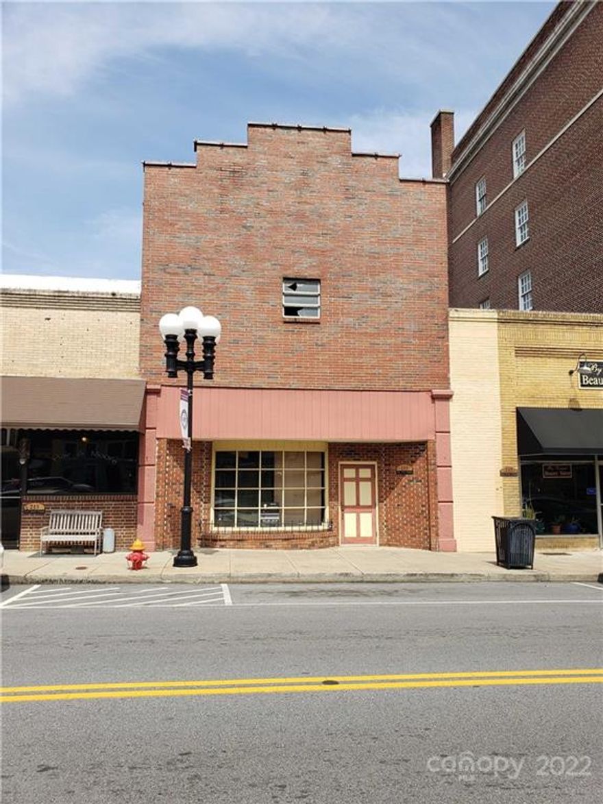 Calling all Investors!  Historic Main Street brick building with amazing potential.  Currently a blank canvas or use the approved renovation drawings available with property utilized as student housing.  Minutes from the University of SC- Union Campus.  Tax assessor's office believes the property was built around or before the 1920's.  Foundation has been leveled and reinforced.  Flooring has been removed from the second floor, all that remains are the floor joists.  Based on available architectural drawings, would add an additional 2414 sq feet to the building.