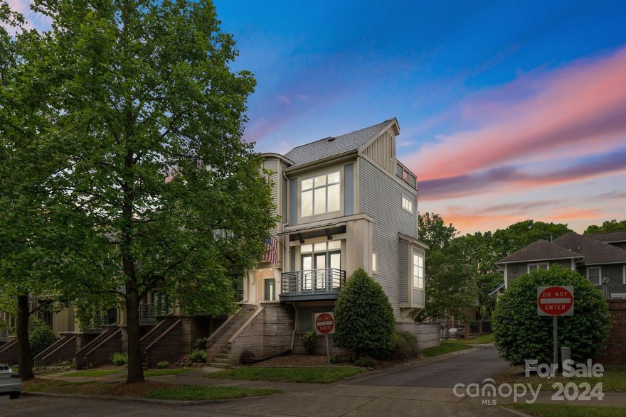 Featuring the BEST ROOFTOP PATIO in Uptown and burrowed in the heart of Charlotte's vibrant First Ward District is this dream urban end-unit. As you enter the main level, the open floor plan warmly greets you, effortlessly connecting the living & dining rooms with the kitchen. Ceiling-to-floor windows adorn both sides of this space and the kitchen offers quartz countertops. The lower floor houses one bedroom & full bath along with an open space which could be a living room or media room. This is where you'll access the patio and artificial turf surrounded by the privacy fence. On your way to the upper level, you'll pass an adorable landing space. On the upper level, one side is home to an office with large windows overlooking the city and the other is home to a bedroom with breathtaking views of Charlotte. The rooftop patio was rebuilt in 2019 and it does not disappoint! The views of Charlotte's skyline are spectacular and the charm of this patio will have you never wanting to leave!