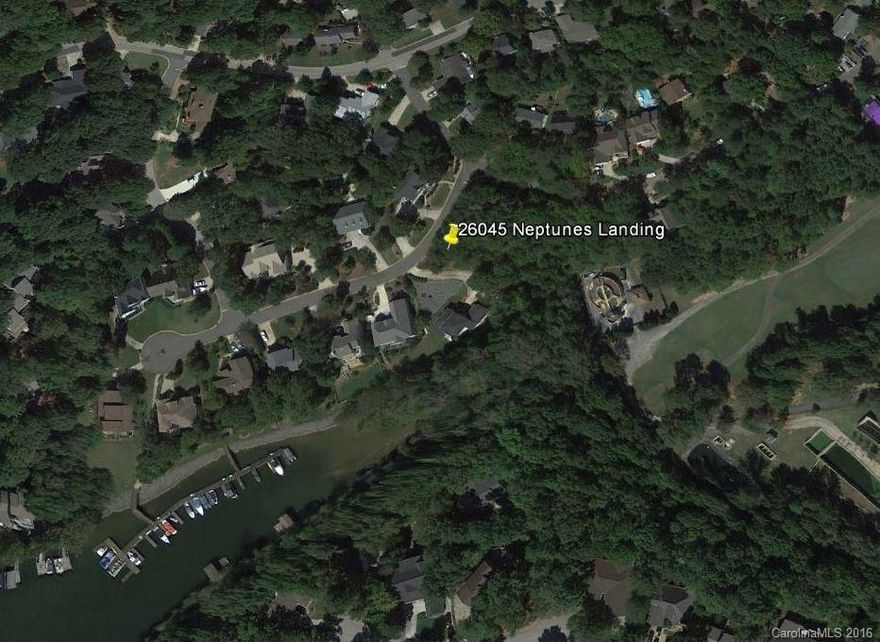 Build your dream home on this corner wooded lot! Includes boat slip at marina in a beautiful well established neighborhood in Tega Cay!  Love to fish, boat or just enjoy the outdoors. Come take a look at Neptune's Landing!