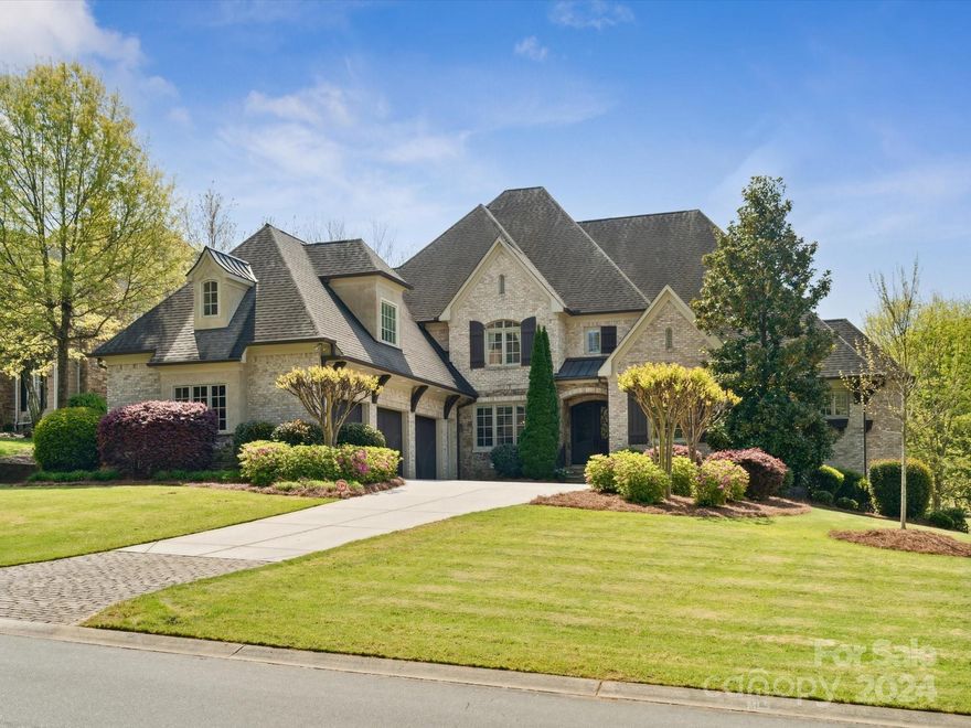 Welcome to this must-see Ballantyne Country Club basement home, perfect for everyday living and entertaining! Stunning golf course and lake views, expansive open floor plan, quality millwork, and tons of natural light await you upon entry. Main level features sizable primary bedroom, ensuite guest room, and hardwood flooring. Spacious kitchen with double-slab island, eat-in area, walk-in pantry, and wood-burning fireplace. Additional primary bedroom located on the lower level, along with living area, bar, gym, media/game room, bonus 1000sf+ unfinished storage room, and access to the backyard. Upper level has 3 ensuite bedrooms, walk-in storage, and massive rec room. Stunning details throughout - vaulted ceilings, beams, 5 fireplaces, custom closets, and plantation shutters. This former builder’s home offers the best of both worlds with breathtaking view, and a private backyard oasis with saltwater pool, hot tub, firepit, and more. Amazing location near all that Ballantyne has to offer!