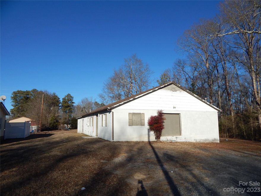 Welcome to an extraordinary opportunity! This expansive 0.99-acre lot showcases a remarkable 2400 sq ft workshop, a true haven for enthusiasts and professionals alike. The workshop boasts an impressive bay door and convenience with two half baths. Positioned strategically with road frontage on both Sifford St and Generation Lane, this property offers not just space but versatility.  Sold as is.