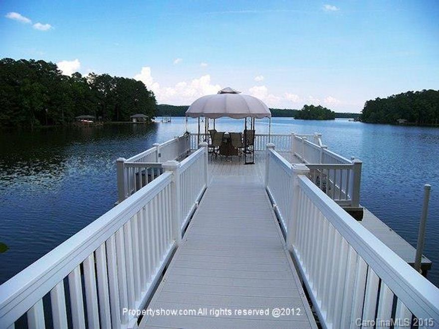 Moonlight views from this fabulous lakefront property are magnificent!  This custom built home has it all.  Upgrades galore, hardwoods, Silstone, custom cabinets, screened porch off master suite with lake views.  Floating dock on deep water. Open floor plan. Workshop, finished bonus. Walk out to the lake from the lower level. Too many extras to note.  This is a must see property to appreciate the quality within.