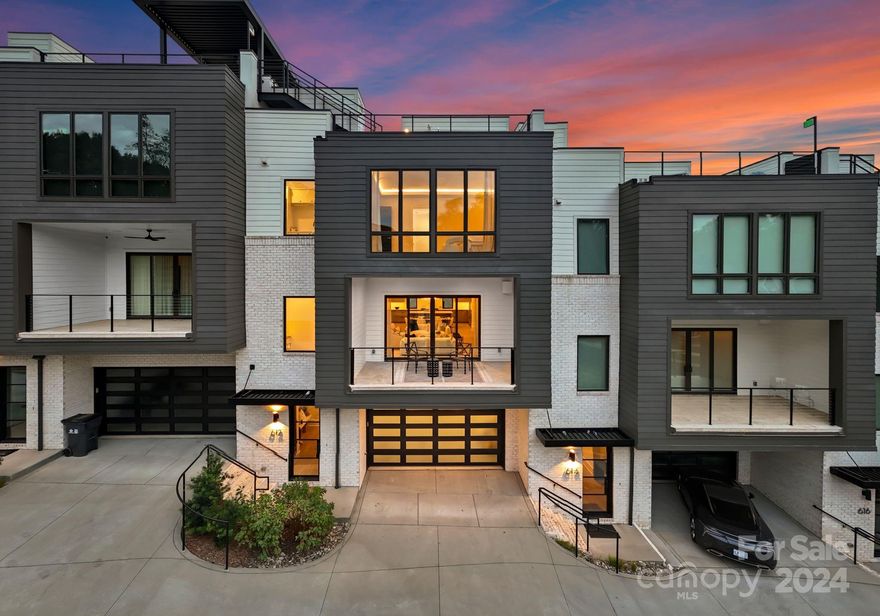 Welcome to this stunning modern townhome located in the highly sought-after Myers Park area. This beautifully crafted residence, part of an elite five-unit enclave by Chiott Custom Homes, is just steps from shopping, dining, and the Little Sugar Creek Greenway. The townhome offers a private 2-car garage leading to a shiplap-accented drop zone, flex guest room/office with an en-suite bath, and access to a serene outdoor space. The main level is designed for entertaining, featuring a light-filled, open floor plan, a chef’s kitchen with Sub-Zero and Wolf appliances, and a large working island that connects to the dining area and family room. Enjoy a cozy covered balcony with views of Queens Road or unwind in your private planning office. The upper level includes a luxurious primary suite with a spa-like bath, two guest rooms, a full bath, and a laundry room. Take the elevator to the rooftop terrace and enjoy panoramic views of the Queen City skyline-perfect for hosting gatherings!