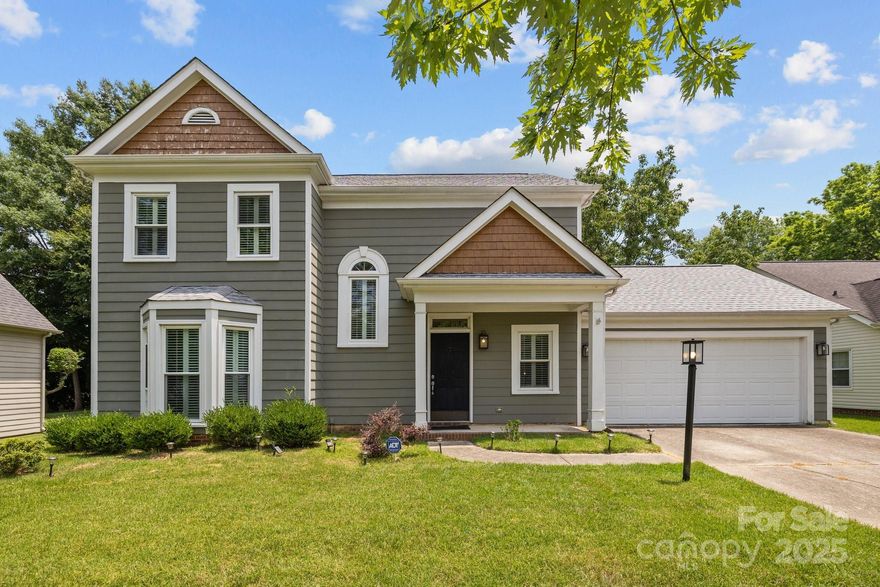 Beautiful yard with mature trees, well kept home in sought-after Cameron Wood!  Move-in ready with newer roof & windows (2023), A/C (2022), fresh paint & new carpet. Main level features a large great room with hardwoods and fireplace. Kitchen has stainless steel appliances, granite countertops, tons of cabinet storage space, and a breakfast area. Half bath on the main. Upstairs you'll find 3 bedrooms & 2 full baths, including an updated primary suite with a vaulted ceiling, dual vanities, separate tub and new shower. The guest bathroom was updated in 2022. Plantation shutters throughout! Enjoy outdoor living on the backyard patio overlooking the fenced yard (2022). 2-car garage, attic storage, and more! Located on a cul-de-sac with access to pool, clubhouse, and tennis courts.