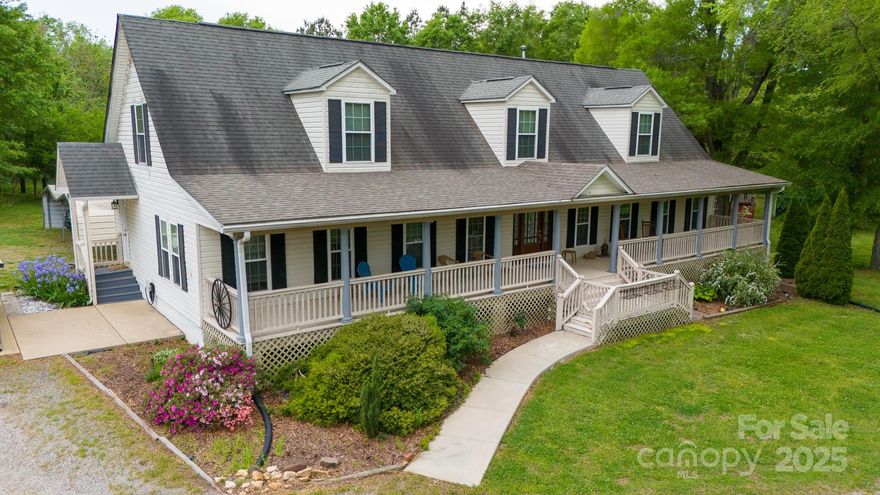 Escape to the countryside with this charming Cape Cod home, nestled on over 5 acres of mostly cleared, partially fenced land. This property offers plenty of space to grow and enjoy outdoor living. Relax on the inviting front porch or entertain on the screened porch and wood deck, while soaking in the serene surroundings.  Inside, the main level features a spacious living area, a primary suite, along with two additional bedrooms. Upstairs, you'll find another bedroom, a full bath, a recreation area and a storage room. Plus there is potential for an extra bedroom but the septic permit is 4 bedrooms. The finished basement adds even more flexibility, offering a second kitchen, full bathroom, flex room and garage access. For those who love the outdoors, this property is a dream! Five outbuildings convey, including a chicken coop, workshop, and greenhouse—perfect for hobbyists, gardeners or storage. There is a railroad track near home that runs several times a day but does not bother Seller.