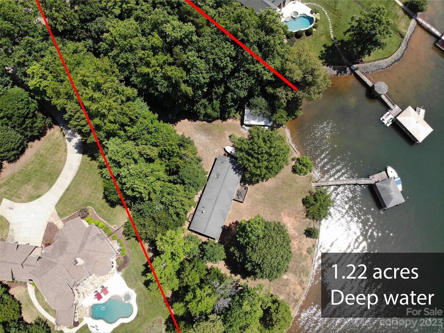 Extraordinary 1.22 acres level lot on Lake Norman with amazing water frontage, covered boat slip and boat house. Located in premier neighborhood and exceptional lake location. Mobile home on property to convey at no value.
