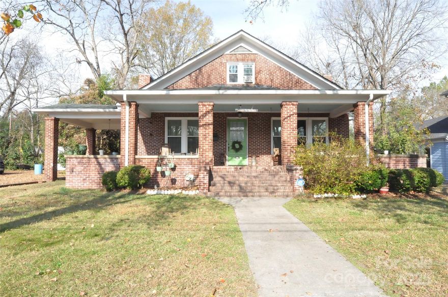 Step back in time with this beautifully preserved 1915 historic home, filled with original character and timeless appeal. Most of the home features original pine wood flooring, adding warmth and authenticity throughout. The inviting family room offers tall ceilings and a classic fireplace, while stunning French doors lead into a bright parlor with abundant natural light. Entertaining is a delight in the elegant formal dining room complete with a charming chandelier. The cozy butler’s pantry adds both function and period charm. A spacious primary bedroom provides room for seating and showcases its own fireplace. The den features gorgeous built-in wood cabinetry and overlooks the fenced backyard, perfect for relaxing or hosting guests.  Located in the growing town of Chester, this home offers the quintessential small-town feel with friendly neighbors, walkable sidewalks, and easy access to downtown shops, restaurants, and local coffee spots. Don’t miss the opportunity to own this enchanting piece of Chester’s history.