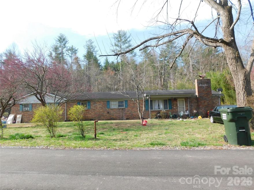 Situated at the end of a quiet street in the unrestricted Green Acres subdivision, this 3-bedroom, 1.5-bath home rests on a level and usable 0.71-acre lot, offering both privacy and flexibility.  Shaw Creek borders the backyard, creating a peaceful natural setting, and just across the creek lies the Ecusta Trail—ideal for walking, biking, and enjoying the outdoors right from your own property.  Less than 5 minutes from downtown Hendersonville, you’ll have easy access to shops, restaurants, and local activities, while the entrance to Pisgah National Forest is only 20 minutes away.  This property is a renovation project with excellent potential—perfect for investors or buyers looking to bring their vision to life in a highly desirable location.  Don’t miss this opportunity to create something special in a prime location with natural beauty and no restrictions.

Properties with direct proximity to the Ecusta Trail are increasingly sought after. This is a unique opportunity to secure a large lot in a high-growth corridor before it's gone.